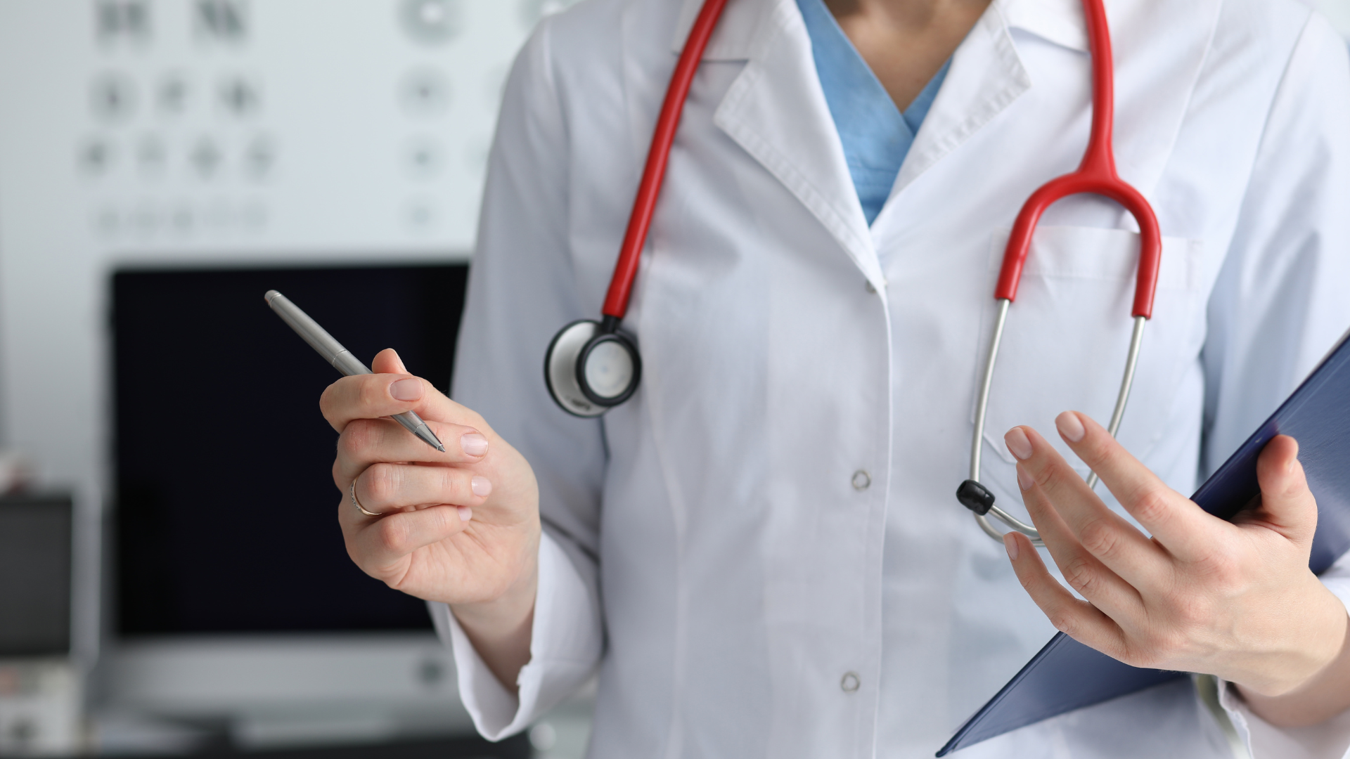 Doctor holding a pen and stethoscope