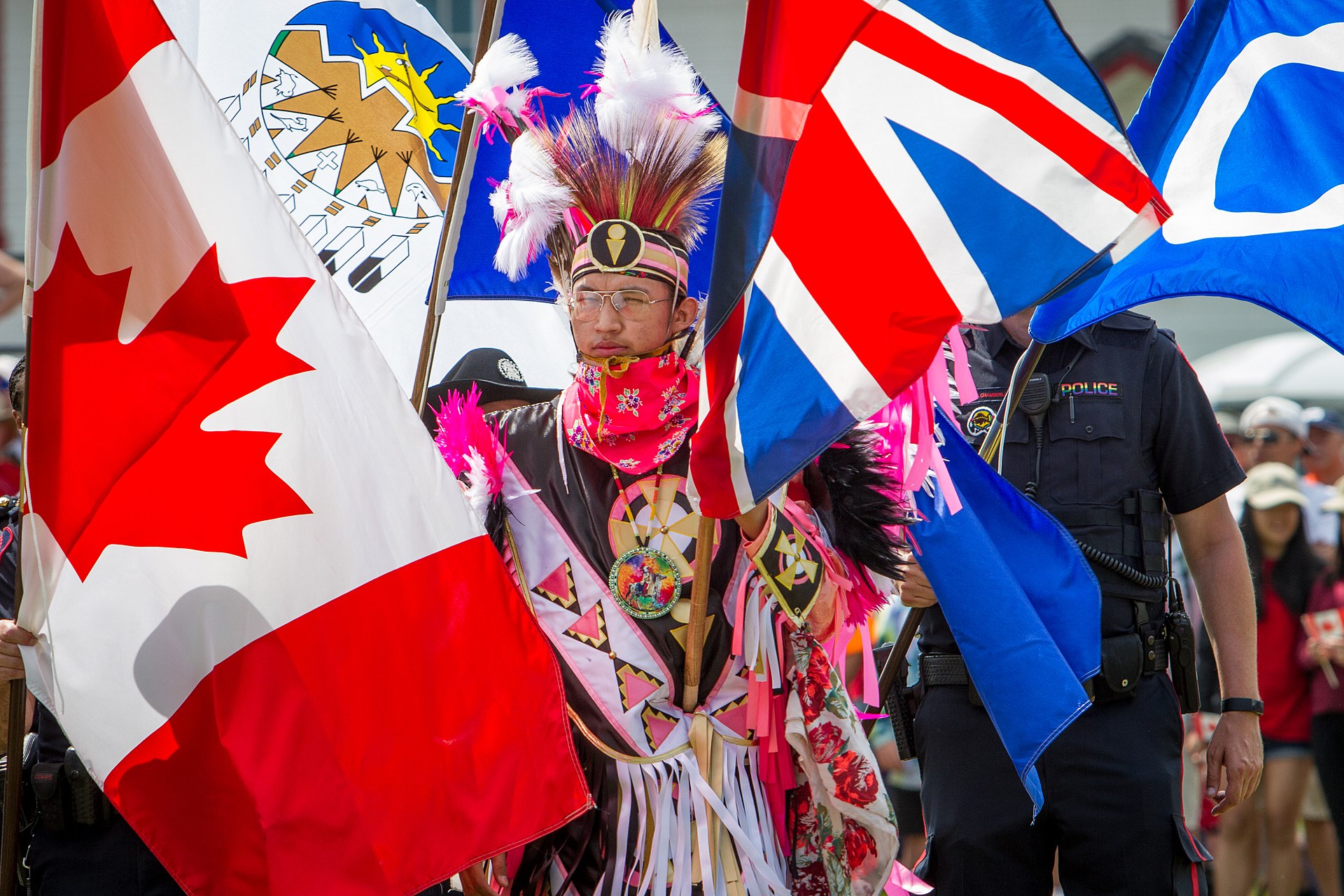 Canadian flags in a parade on Canada Day