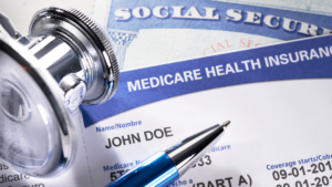 Medicare and social security card on the table with a stethoscope  