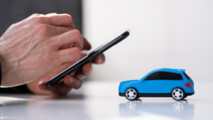 Man on his phone looking into auto insurance